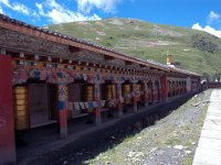 China  Tagong. Tagong Temple in town. Prayer wheels surround the monastery wall. : Asia, China, Tagong Grassland, Tagong Temple, Temple