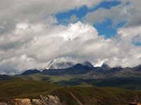 China  Tagong. Grasslands. Snowcapped mountain in the distance. : Asia, China, Mountains, Tagong Grassland