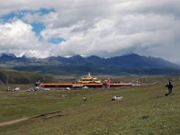 China  Tagong. Grasslands. Second monastery on the Grasslands under contruction. The silver car tried to drive up the hill for about 5 minutes then gave up. : Asia, China, Mountains, Tagong Grassland, Temple