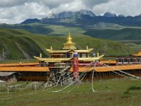 China  Tagong. Grasslands. Second monastery on the Grasslands under contruction. Snowcapped mountain in the distance. : Asia, China, Tagong Grassland, Temple