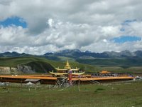 China  Tagong. Grasslands. Second monastery on the Grasslands under contruction. Snowcapped mountain in the distance. : Asia, China, Tagong Grassland, Temple