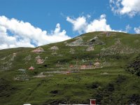 China  Tagong. Grasslands. Prayer flags dominate the mountainside sending prayers to the heavens. : Asia, China, Mountains, Tagong Grassland
