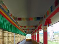 China  Tagong. Grasslands. Prayer wheels surround the outside of the second monastery. : Asia, China, Prayer Wheel, Tagong Grassland